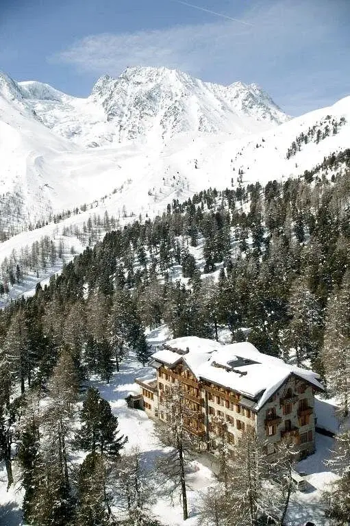 Aerial winter view of the snow-covered Grand Hôtel & Kurhaus in Arolla
